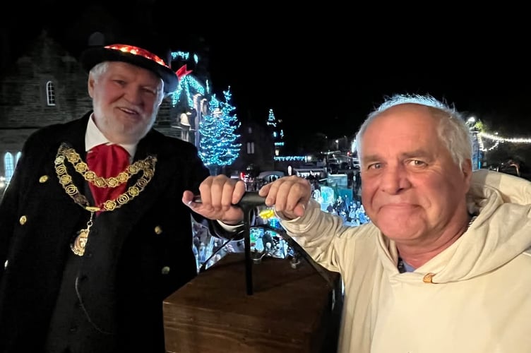 Ian Lashbrook (retired long-serving Tavistock Town Council employee) switches on town centre Christmas lights with town mayor Cllr Steve Hipsey for the launch of Tavistock Dickensian Evening.