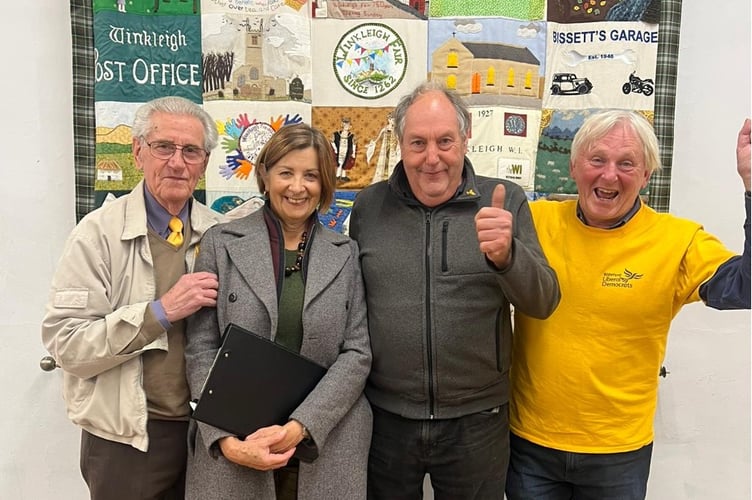 Steve Middleton celebrates topping the poll in the Winkleigh by-election. With Councillor Teresa Tinsley and campaigners Ray Morgan (left) and Stephen Potts 9 (right