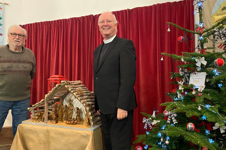 Tavistock Methodist Circuit Minister John Haley (left) with Yelverton Methodist Church electrician Tony Sprague at the church Christmas Tree Festival.