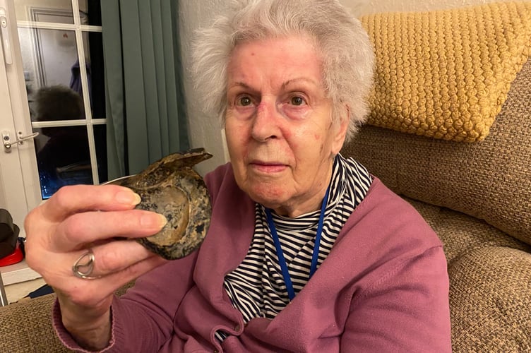 Eileen Bargery with her mystery object she believes is an Tavistock Abbey artefact.