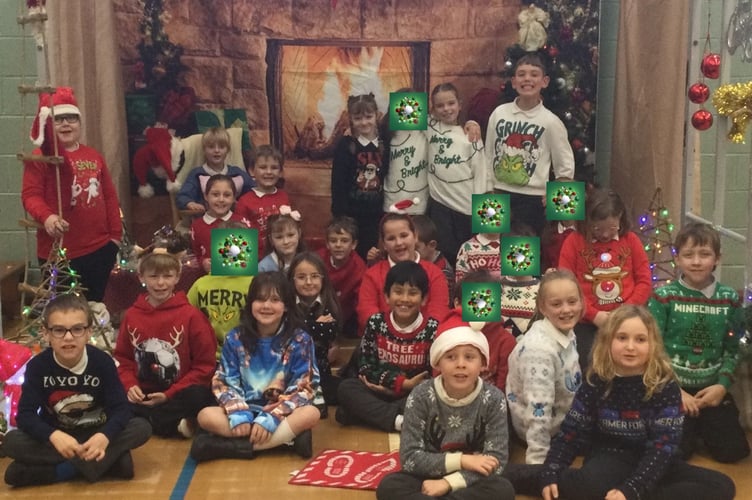 Larkin Class at Bere Alston Primary in their Christmas jumpers.