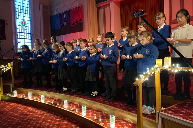 Tavistock Primary School Big Choir has been holding candle-lit carol concerts with enchanting performances in the community, including Tesco, residential homes and Christmas parties.
