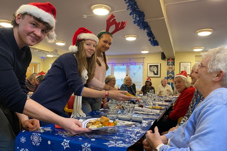 Tavistock Area Support Services treat their users to a festive lunch served by Mount Kelly College students.