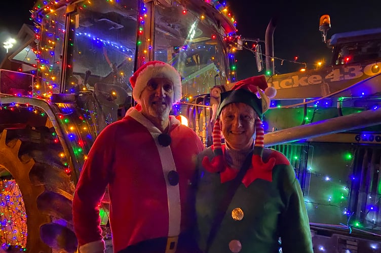 Tavistock AFC festive tractor run farming pair in elf and Santa outfit.