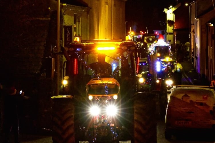 A noisy rally of colourfully lit tractors drew the crowds in Bere Alston and Bere Ferrers for the annual Christmas tractor run to raise funds for small local causes. Pictures by Mike Wright.