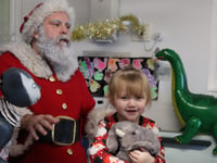 Sick children's theatrical Santa joy 