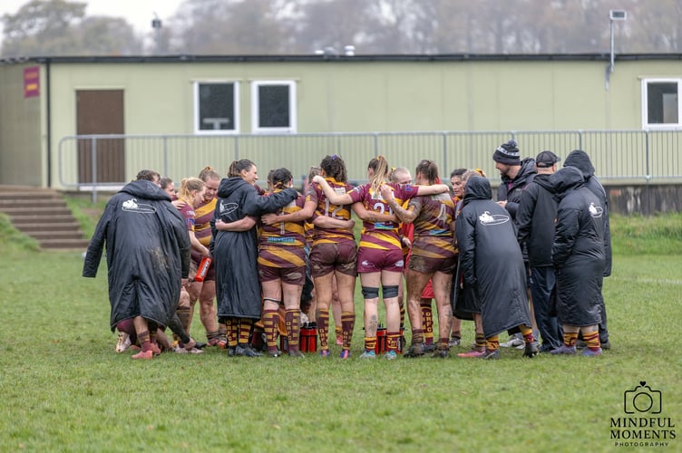 Okehampton RFC women huddle vs Penryn