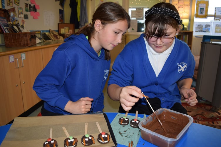 Children make reindeer pops for the St Andrew's School Christmas Fair
