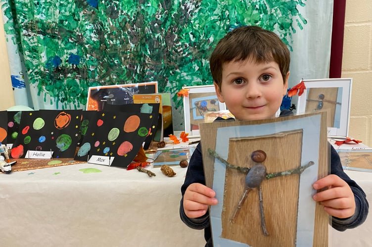Horrabridge School young artists show at school's first ever exhibition. Finn, aged 3, shows his self-portrait using twigs, stones and conkers.