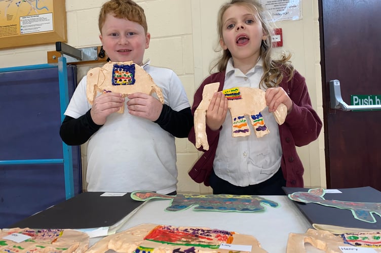 Monty and Eden aged 6/7, show off their Indian elephant artwork at Horrabridge School young artists show at the school's first ever exhibition.
