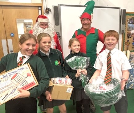 Tavistock Lions brought Santa and chief elf to St Peter's Junior School in Tavistock.