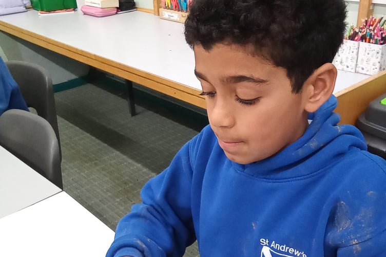 A Buckland Monachorum St Andrew's School pupil enjoys a Farmwise Devon workshop - making scones.