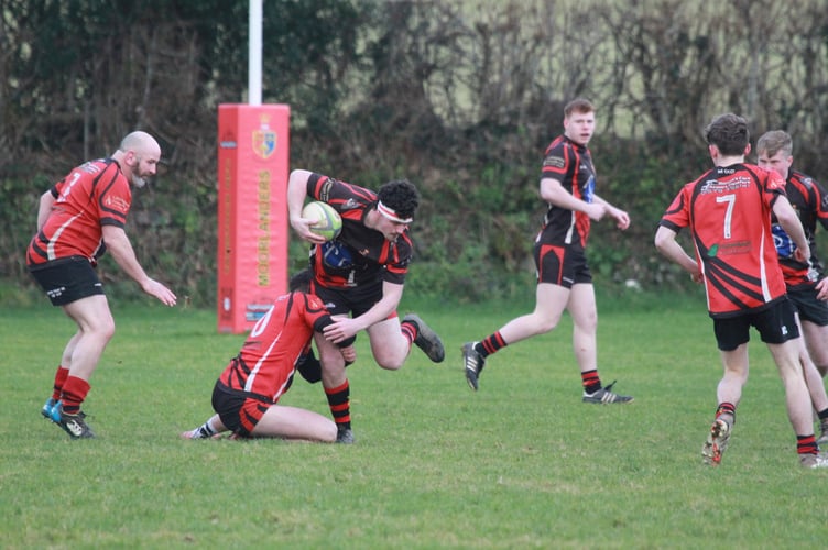 Hard tackling from Tavistock Rugby Club's Boxing Day game Locals v Legends. Picture Chris Hair.