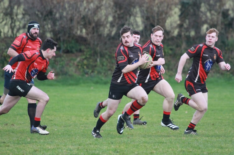 Hard chasing from Tavistock Rugby Club's Boxing Day game Locals v Legends. Picture Chris Hair.