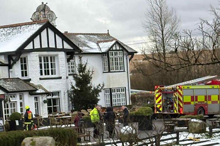 Guests were left shivering in the snowy cold after being evacuated from the Two Bridges Hotel on Dartmoor this afternoon after a suspected electrical fire.