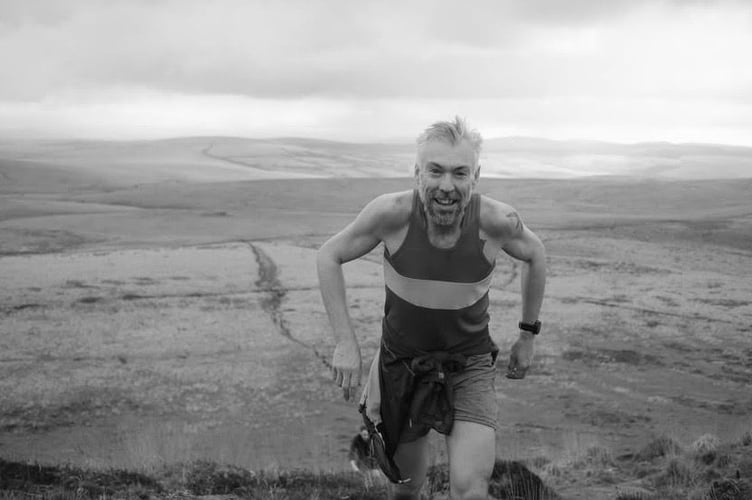 Rob Hicks (ORC) near the top of Brown Willy, the highest tor on Bodmin Moor on the hilly, rocky and boggy seven-mile race.