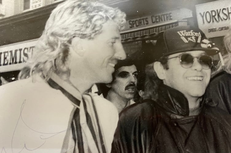 Keith Hall's prized photo of Ian Botham on a John O'Groats to Land's End charity walk in Okehampton, with supporter Elton John. Only when it was processed did Keith see who was in the photo.