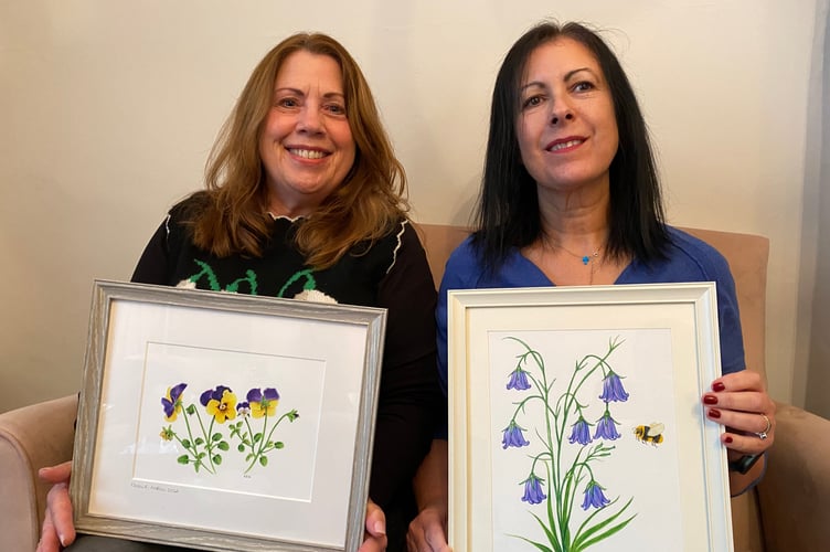 Artist Karen Austin, left, donating her water colours to Salema Dennis of Drake Lodge in Tavistock.