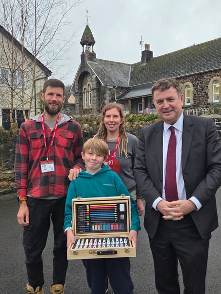 Sir Mel with Ruairi and parents Ian and Lou.