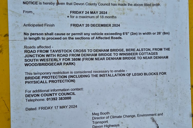 The Devon County Council highways notice remains at Denham Bridge two years after the unsightly 'Lego' blocks were fitted to repair traffic damage. Residents want to know when more appropriate repairs are planned. Picture by Katie McCarthy.