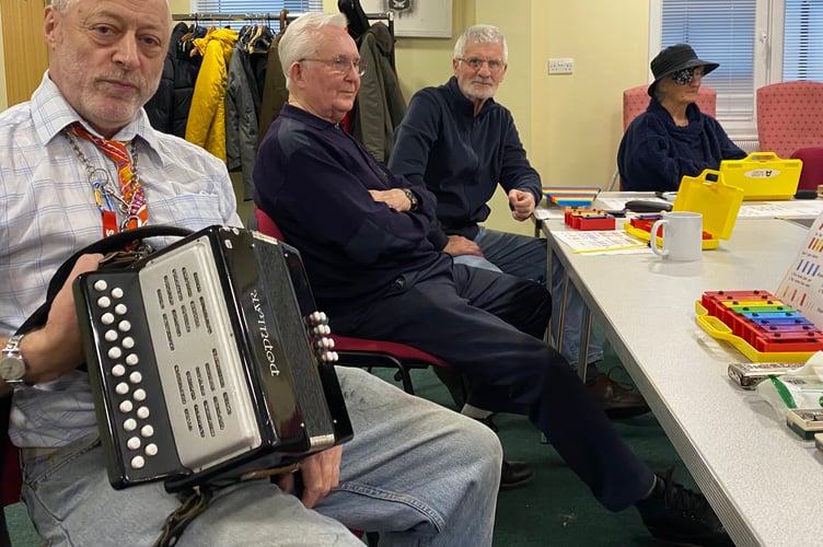 A new music group for beginners and experienced musicians to learn to read music and play instruments has been set up at TASS HQ (Tavistock Area Support Services). Pictured is accordion player Peter Martin with other students.