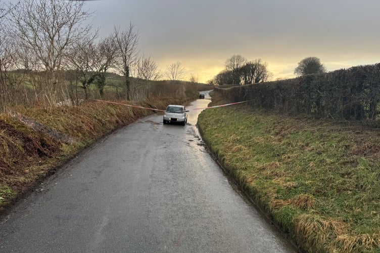 Tavistock firefighters rescued a couple from their car which was stranded on a flooded road after Storm Chandra.