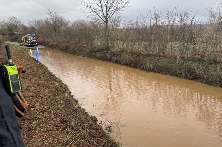 Tavistock firefighters rescued a couple from their car which was stranded on a flooded road after Storm Chandra.