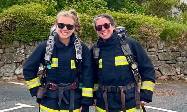 Two Yelverton firefighters Sam and Steffi are raising money to support colleagues in need  with a sponsored walk/climb.