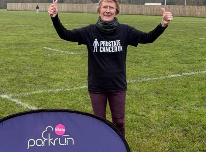 Mags Jarvis celebrates completing her running challenge in aid of Prostate Cancer UK after family deaths.