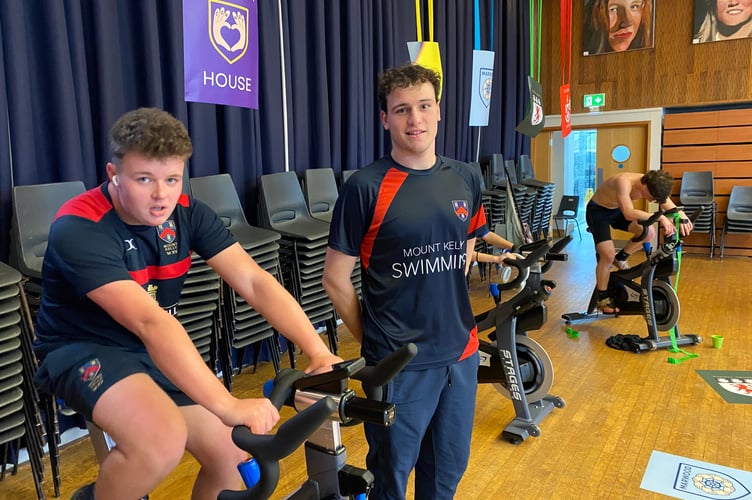 Mount Kelly College student super swimmer Barnaby Ryder motivating the 24-hour fixed cycle ride in aid of mental health.