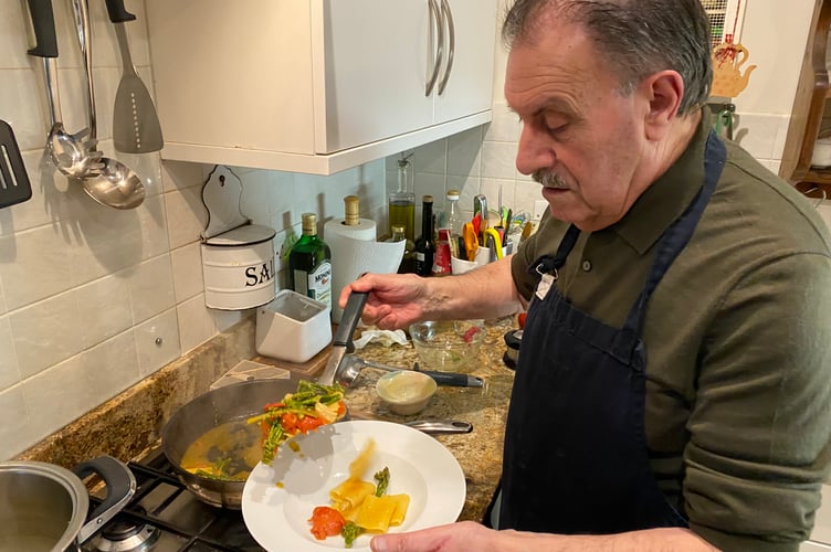 Famed Tavistock cook Giovanni Sponziello serves his patriotic tricolore pasta dish to mark the Cortina Winter OIympics, Cortina.