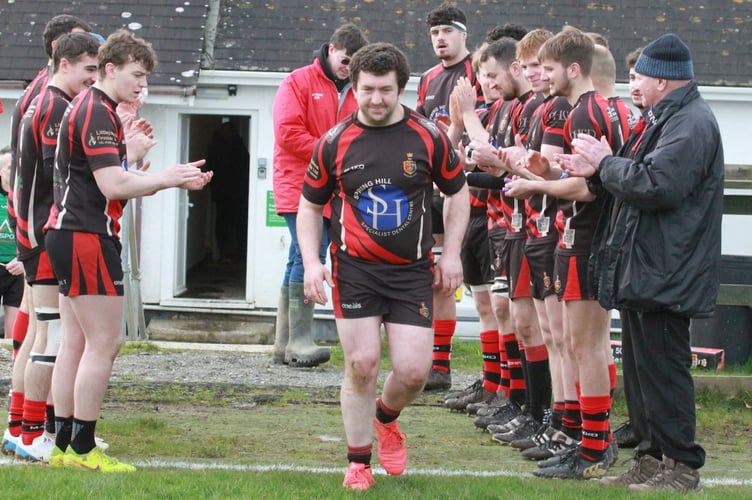 Richard Cann runs out for his 100th Tavistock appearance.