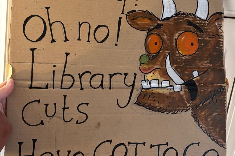 Popular children's book character the Gruffalo features at a protest against cuts at the hours of Devon libraries.