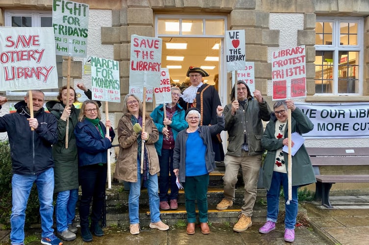 A protest against library cuts outside Ottery Library