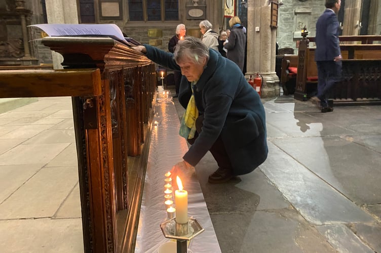 Lighting a candle of peace in a packed St Eustachius' Church in Tavistock marking the fourth anniversary of the Russian invasion of Ukraine.