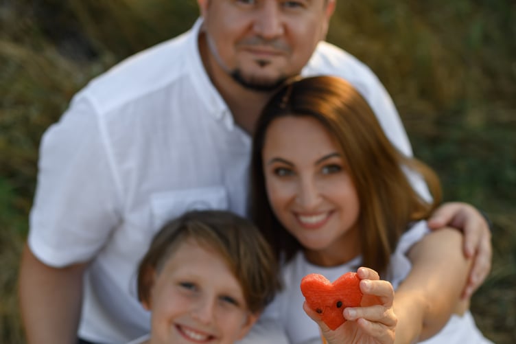 Ukrainian refugee Tania Mayorova, son Hordii, 12, and husband Alex in her beloved homeland.