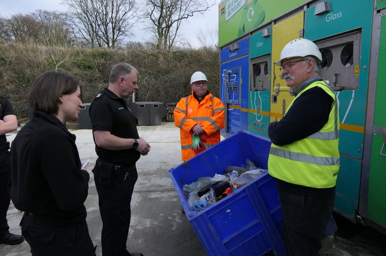 Jeff Moody (far right) talks to representatives from fire service about dangers of lithium-ion batteries.