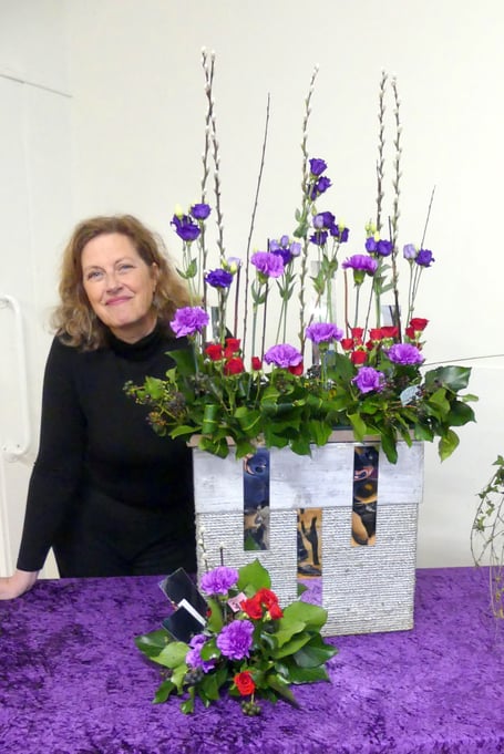 Demonstrator Louise Brown with one of her arrangements inspired by Elizabeth Taylor's diamonds. Picture: Deborah Asbridge.