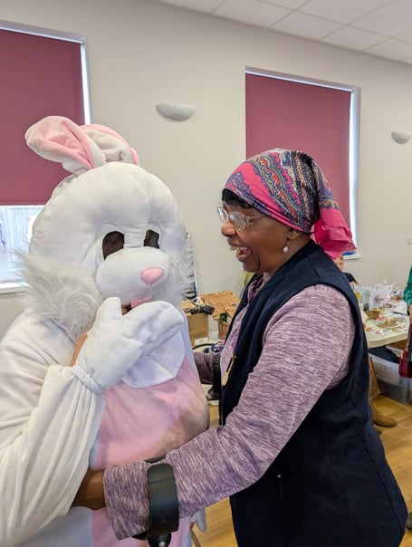 ODCTG user Agnes with the Easter bunny at the coffee morning.