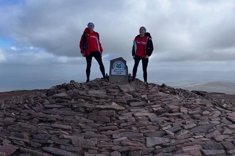 Triumphant on another peaki. On top of the world! Yelverton firefighters Sam Daly and Steffi conquer the Brecon Beacons for the Fire Fighters Charity.