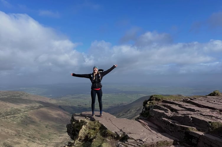 On top of the world! Yelverton firefighters Sam Daly and Steffi conquer the Brecon Beacons  for the Fire Fighters Charity.