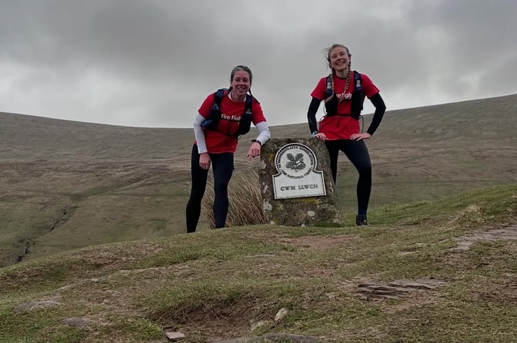 One more peak conquered. On top of the world! Yelverton firefighters Sam Daly and Steffi conquer the Brecon Beacons for the Fire Fighters Charity.