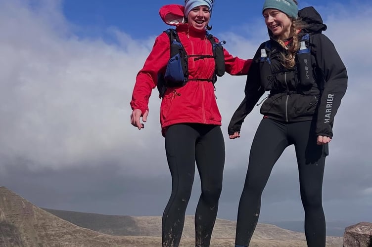 Triumphant on another peaki. On top of the world! Yelverton firefighters Sam Daly and Steffi conquer the Brecon Beacons for the Fire Fighters Charity.
