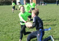 Hard tackling at primary school rugby contest