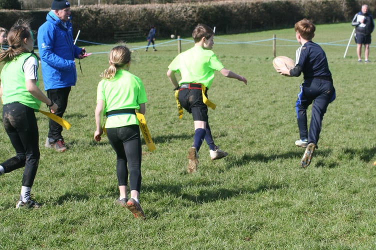 Evading the tackles at Tavistock Area Schools Tag Rugby tournament.