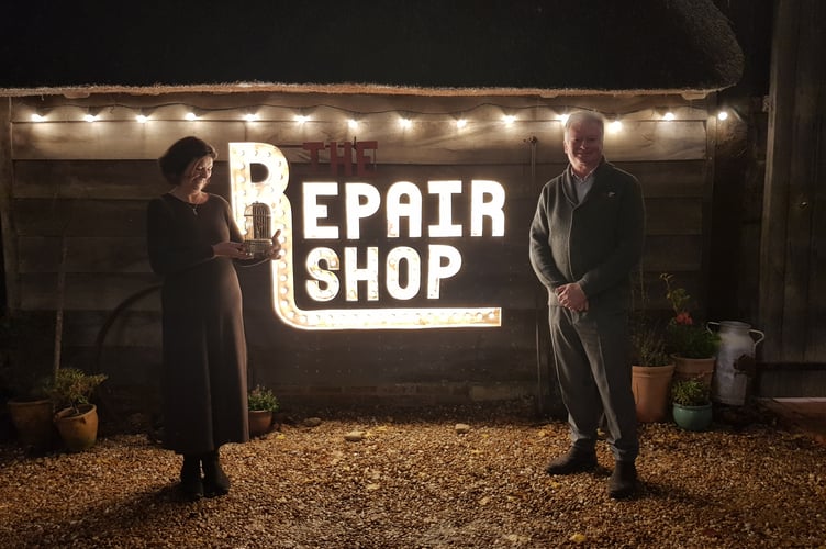 Fenella Haffenden, born profoundly deaf, with her partner Richard Davies at the BBC1 Repair Shop. She is holding her restored model singing bird, enabling her to hear it sing for the first time ever.