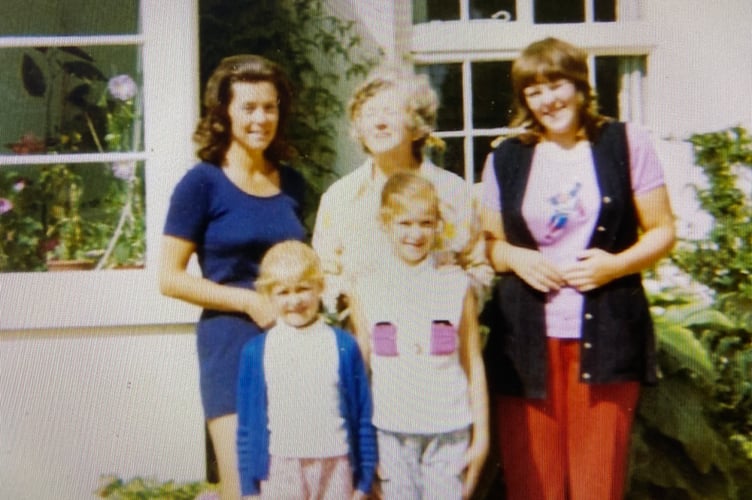 Fenella Haffenden, born profoundly deaf, pictured (front right) on holiday as a young girl. Her granny is in the middle of the back row who originally showed Fenella the wind-up singing bird which she could not hear.  The BBC Repair Shop restored it for Fenella to hear for the first time.