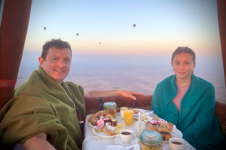 Michael Hollinson and daughter Darcy in a hot air balloon over North Africa