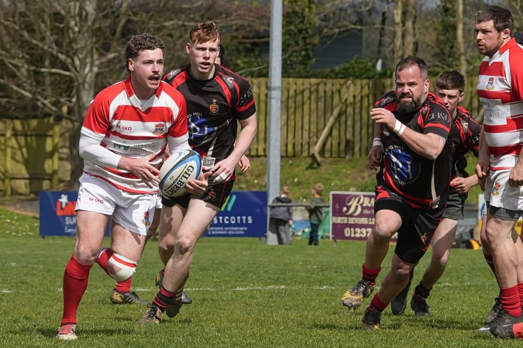 Tavistock (red and black shirts) on the defensive in their 39-12 defeat at Bideford