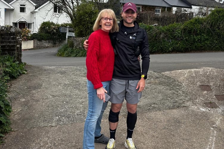 Marathon runner Joe Benjamin-Guest has completed seven marathons in seven days to raise funds in tribute to seriously ill family Steve Hemmings and a cancer charity. Joe is pictured with Steve's wife Sue after the final run. Photo by Kay Benjamin.